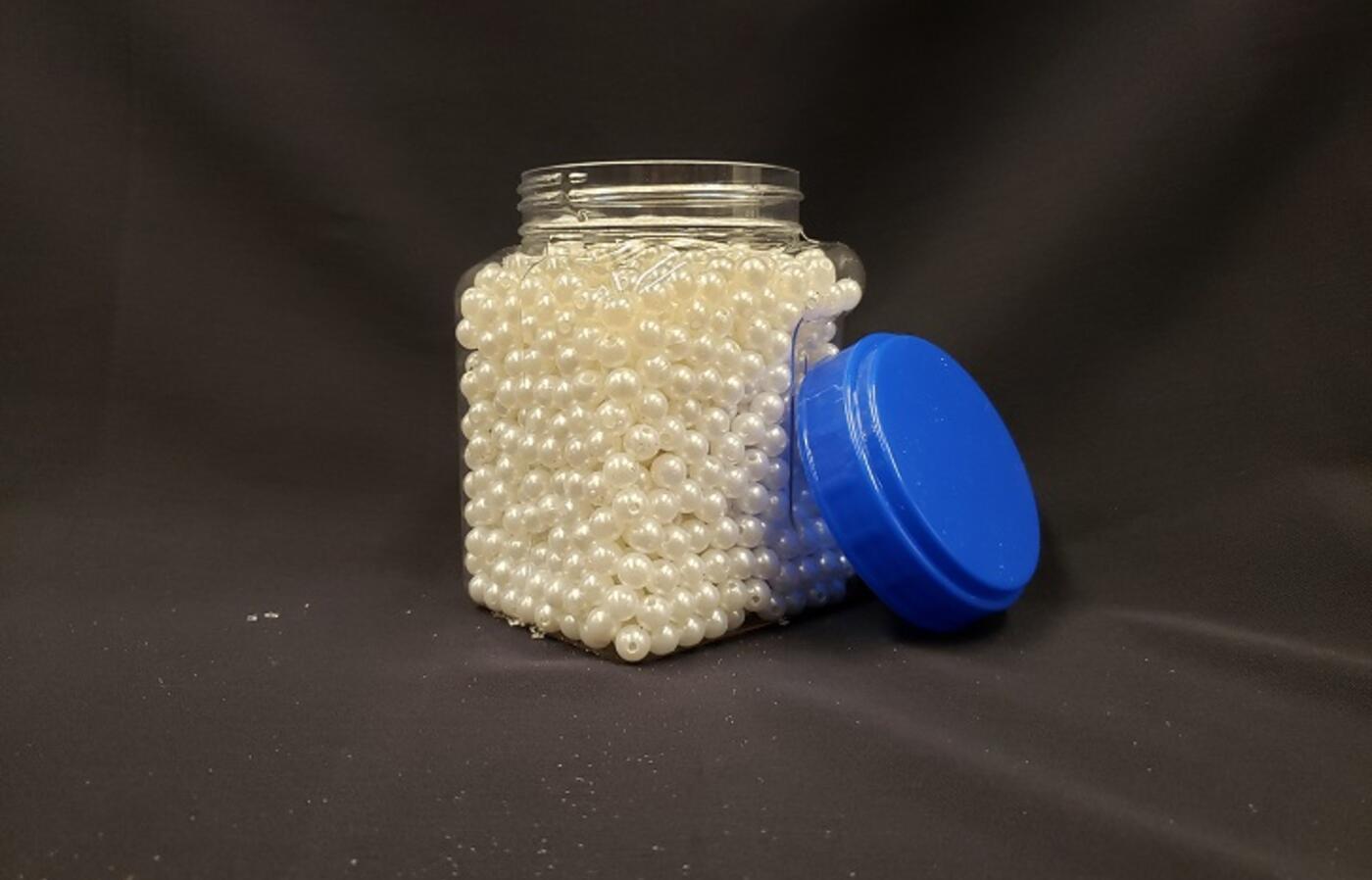 Jar of white pearl beads