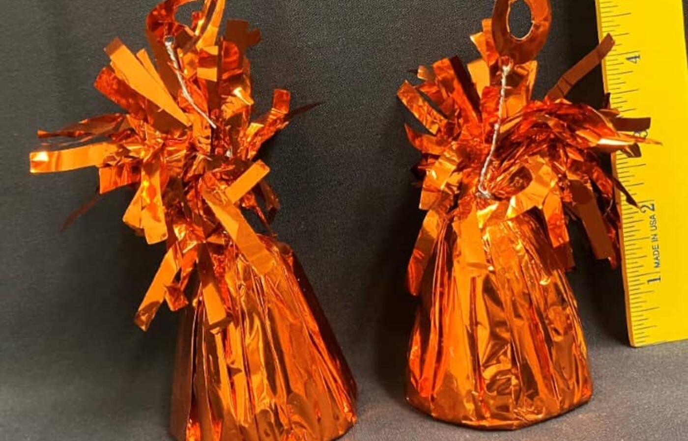 Orange balloon weights