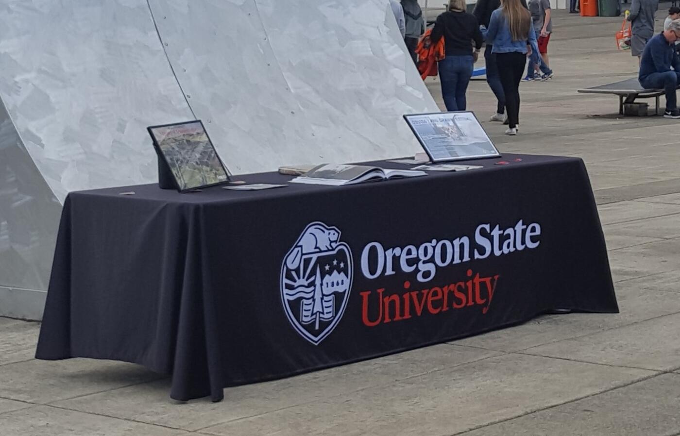Table with a black drape with an OSU Logo on it