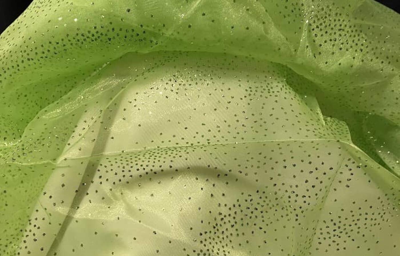 Sheer green glitter drape