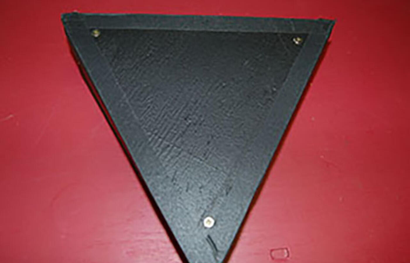 Black wooden triangle riser