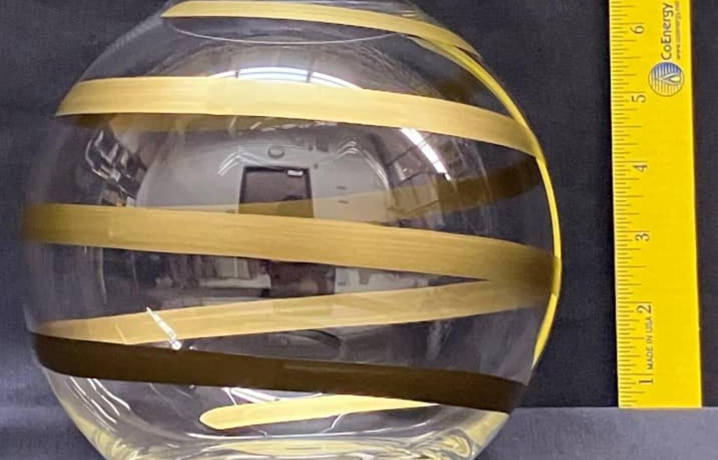 Clear and gold glass fishbowl